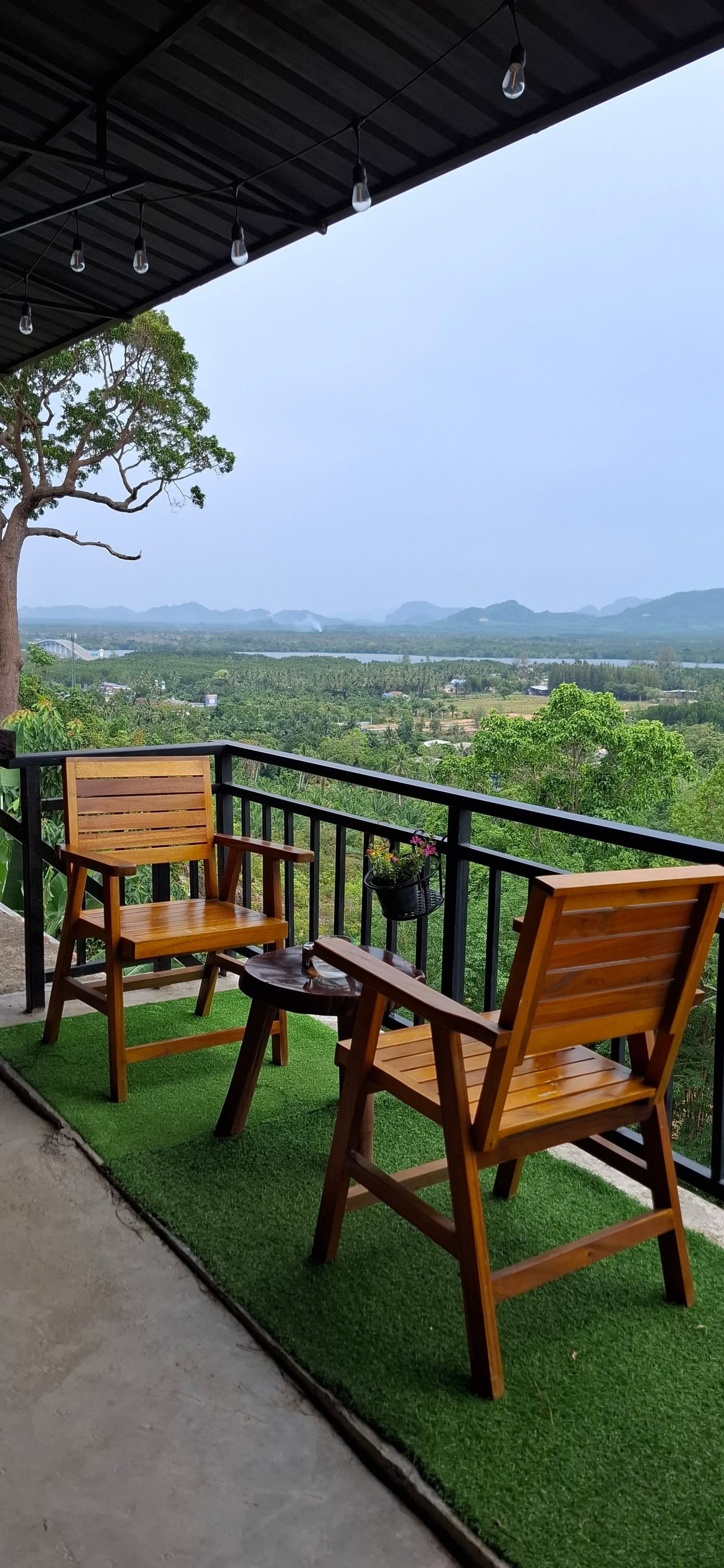 Balcony seating with a wide mountain and valley view