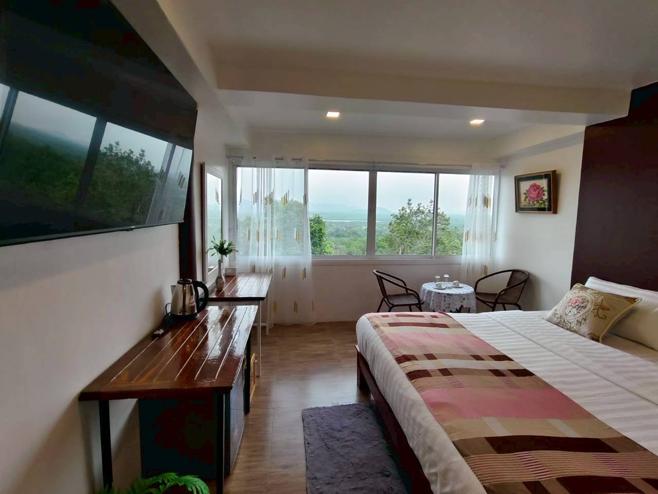 Comfortable resort room with a mountain view from the window